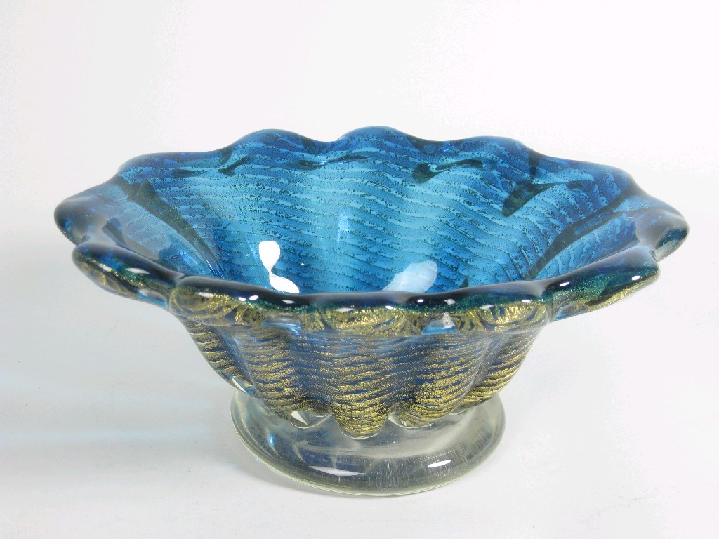 Appraisal: An Art Glass Bowl with fluted edge in blue with