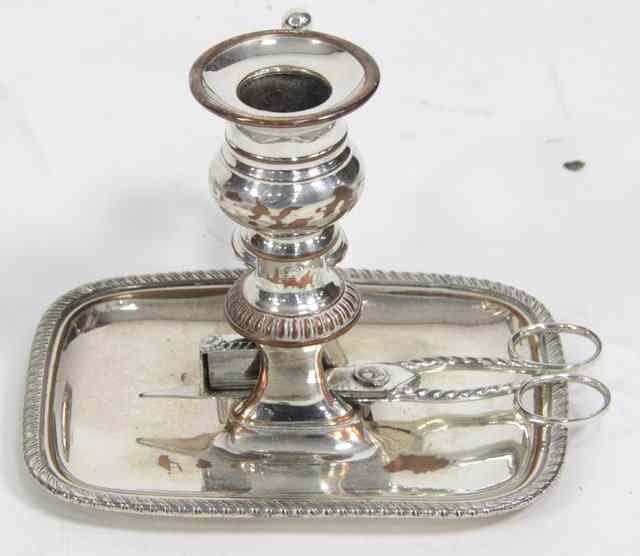 Appraisal: A Sheffield plate chamber candlestick complete with snuffer and wick