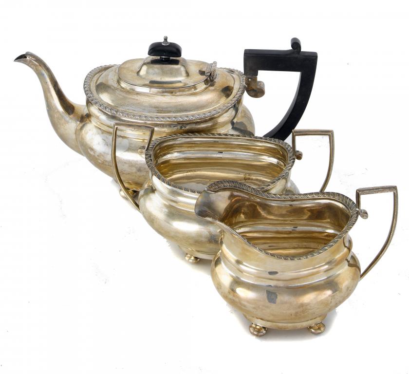 Appraisal: A GEORGE V TEA SERVICE of oblong shape with gadrooned