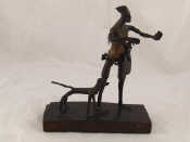 Appraisal: A bronze figure of a hunter with his dog ht