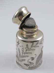 Appraisal: A silver aesthetic movement scent bottle finely engraved with birds