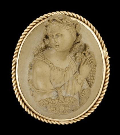 Appraisal: karat yellow gold lava cameo broochHigh relief oval cameo of