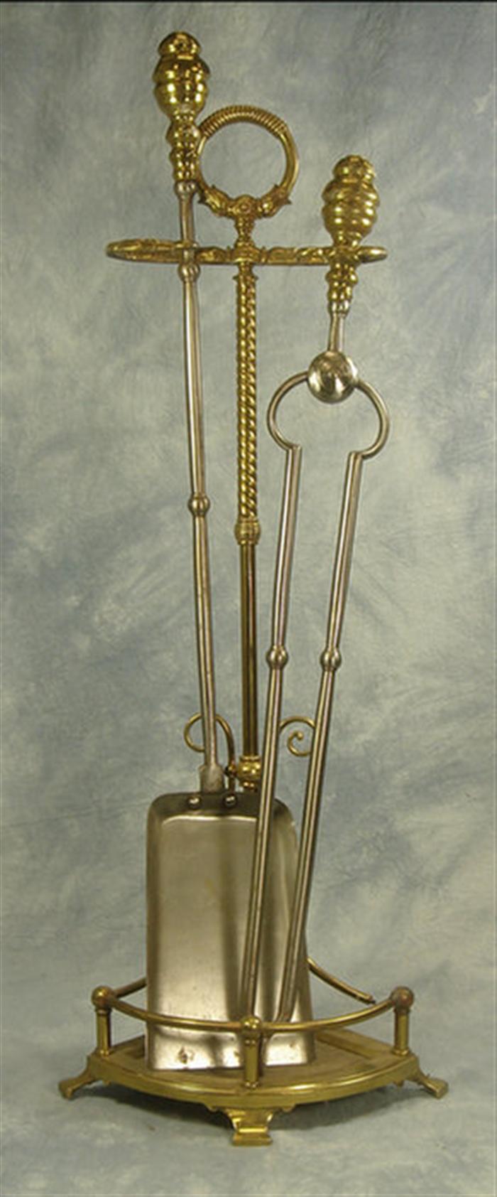 Appraisal: Set brass fire tools on stand with an iron brass