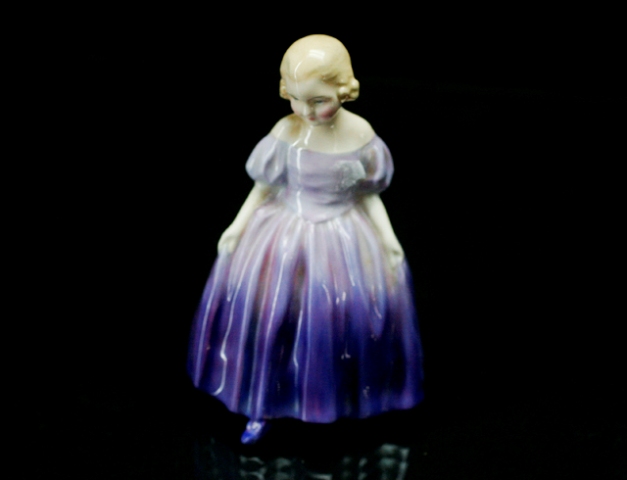 Appraisal: A Royal Doulton 'Marie' figurine together with Royal Doulton 'North