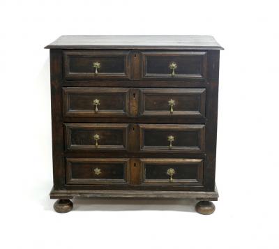 Appraisal: An th Century oak chest with rectangular top fitted four