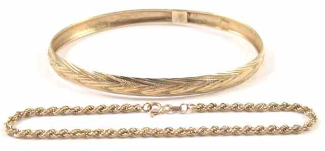 Appraisal: TWO YELLOW GOLD BRACELETS including a k yellow gold oval