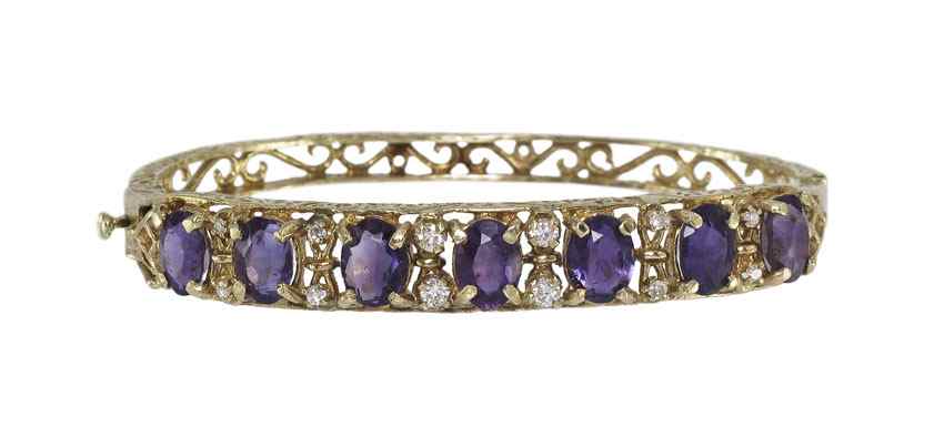 Appraisal: K GOLD DIAMOND AND AMETHYST BANGLE BRACELET K yellow gold