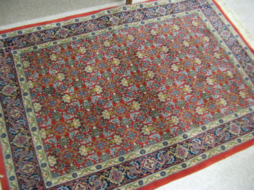 Appraisal: HAND KNOTTED ORIENTAL AREA RUG Indo-Persian overall Herati floral decoration