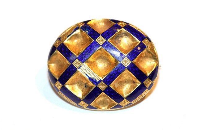 Appraisal: AN OVAL ENAMELLED BROOCH of chequered form