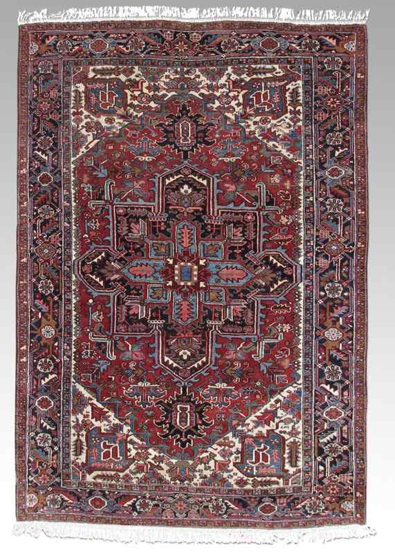 Appraisal: APPROX - YEAR OLD PERSIAN HERIZ HAND KNOTTED WOOL RUG