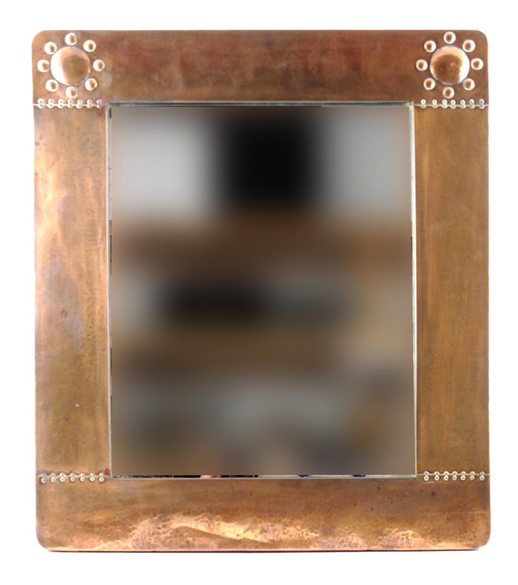 Appraisal: A Liberty amp Co copper wall mirror