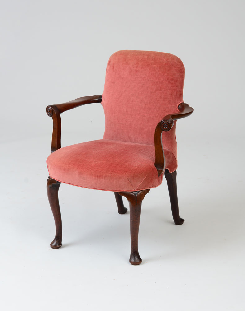 Appraisal: GEORGE III MAHOGANY ARMCHAIR The arched upholstered backrest with outscrolled