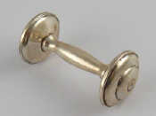 Appraisal: An American silver dumbell baby's rattle marked Sterling