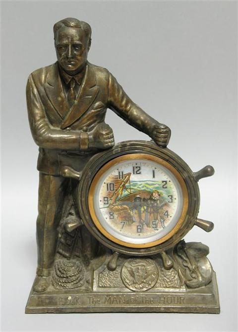 Appraisal: FDR THE MAN OF THE HOUR CLOCK Cast metal clock