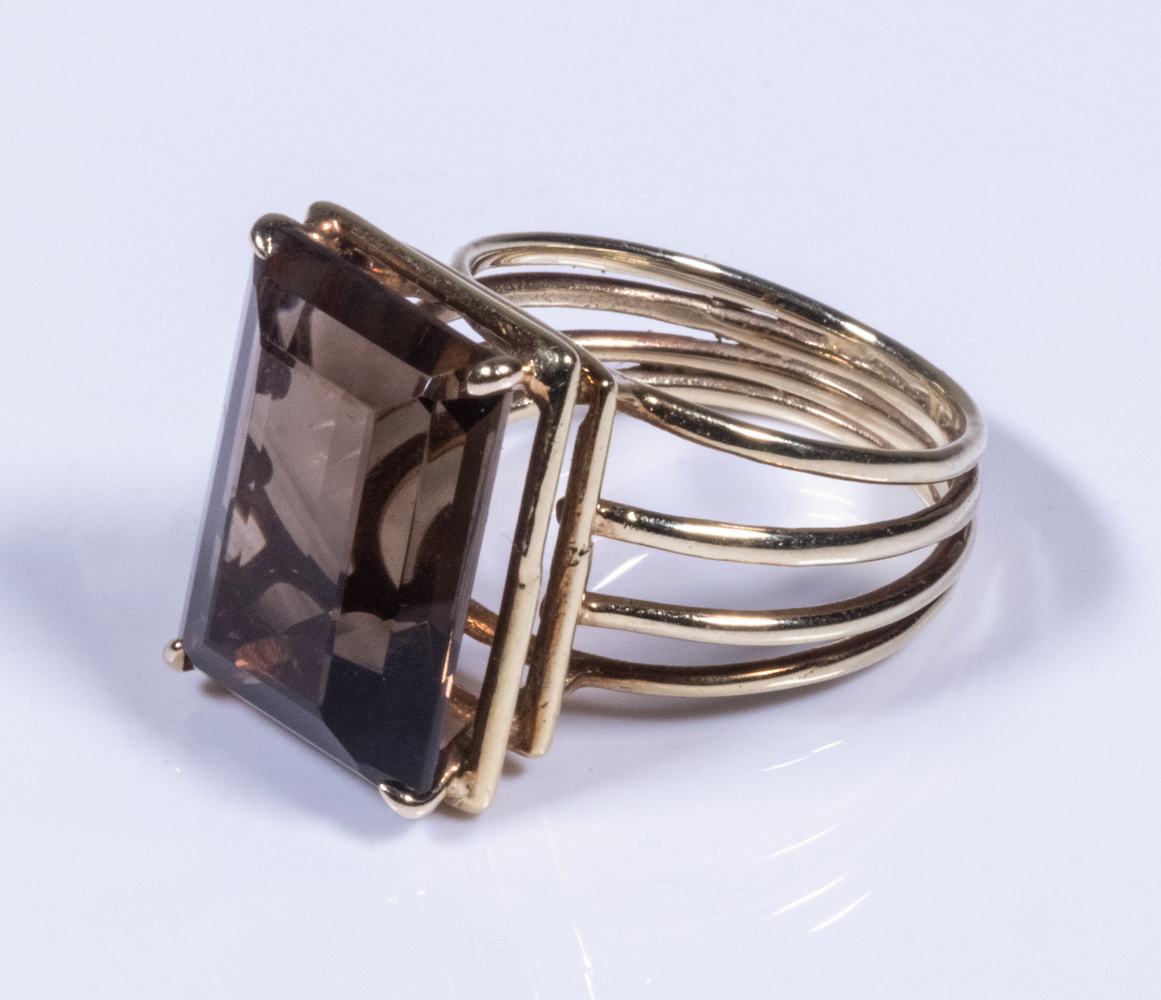 Appraisal: SMOKEY QUARTZ RING Emerald cut quartz in a k gold