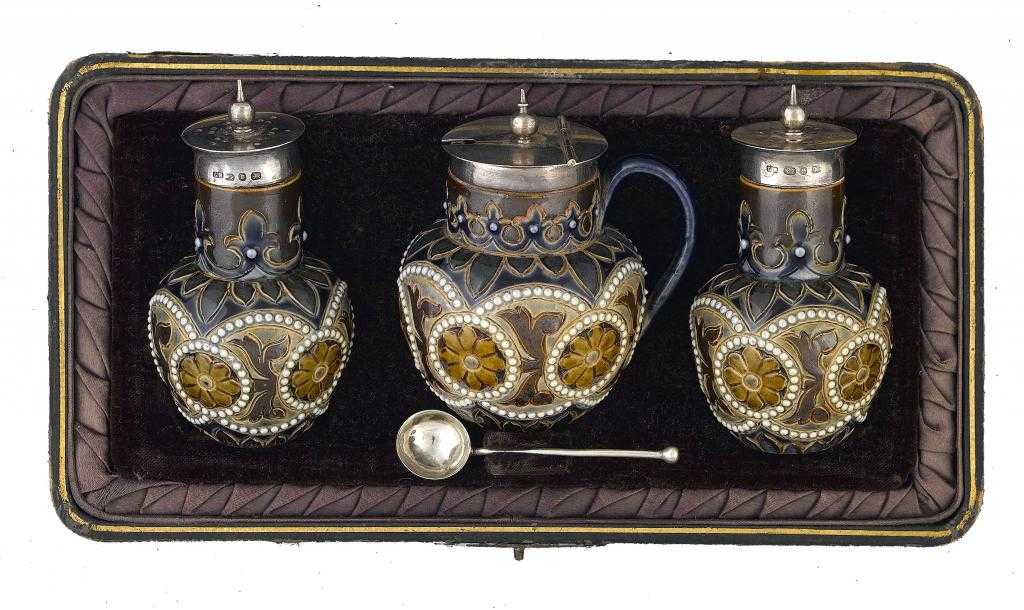 Appraisal: A SILVER-MOUNTED DOULTON WARE CONDIMENT SET BY ELIZABETH ATKINS incised