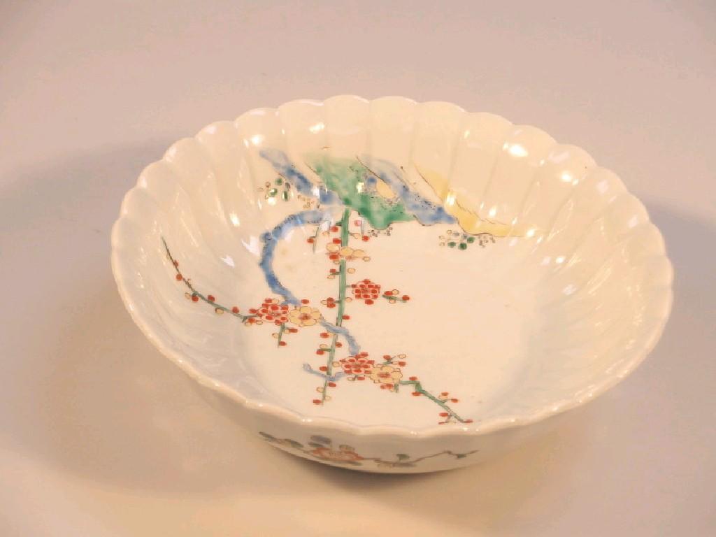 Appraisal: A Kakiemon fluted circular bowl painted in blue iron red