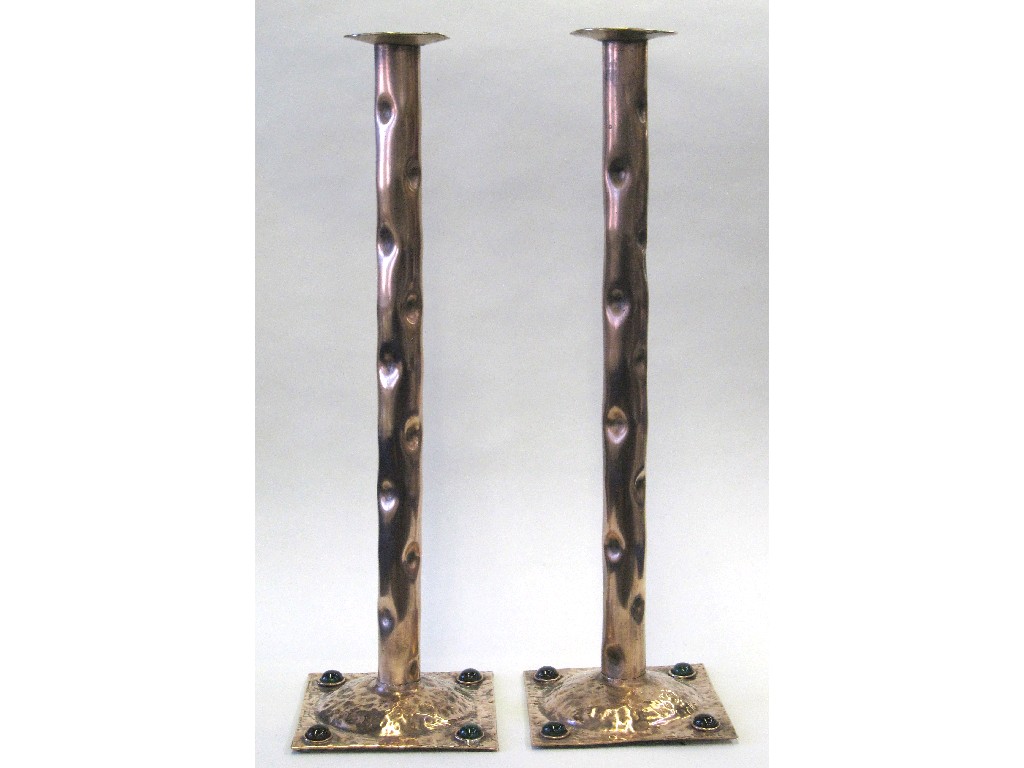 Appraisal: Pair of tall copper candlesticks with stone inset square bases