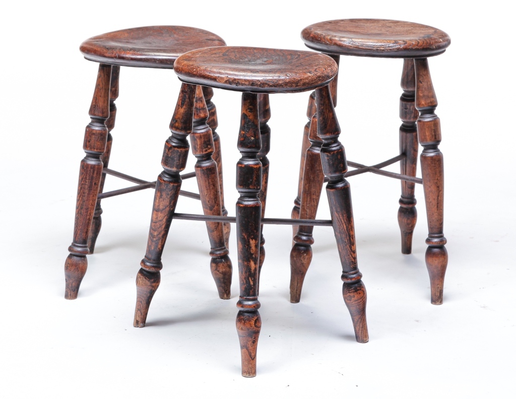 Appraisal: THREE ENGLISH STOOLS Mid ht century yew Turned seats and