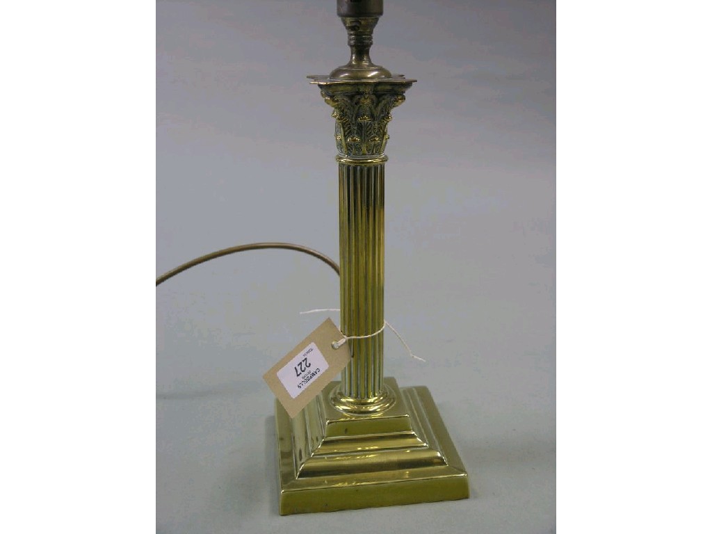 Appraisal: A brass table lamp with corinthian column on stepped square