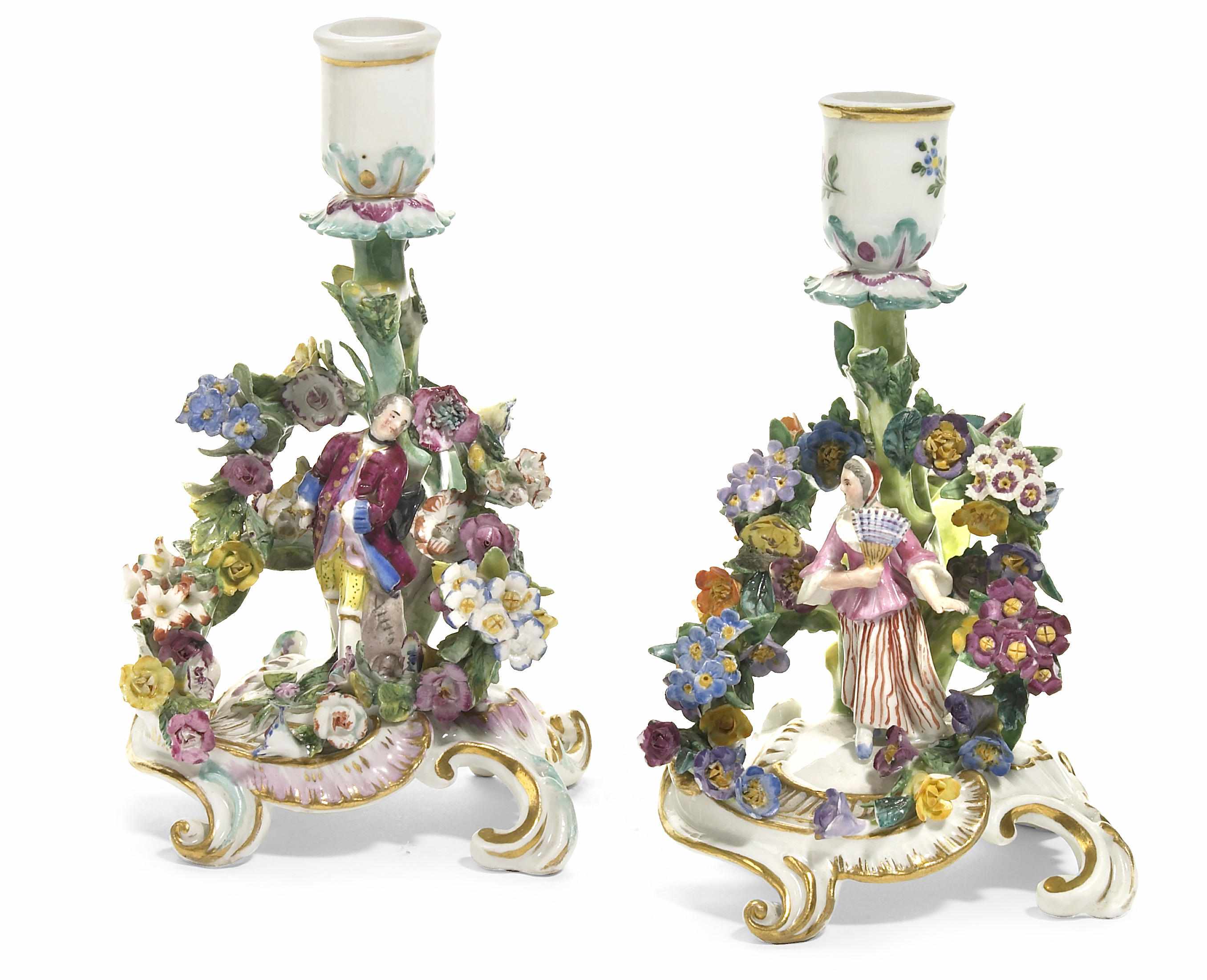 Appraisal: A near pair of Meissen porcelain figural chambersticks late th