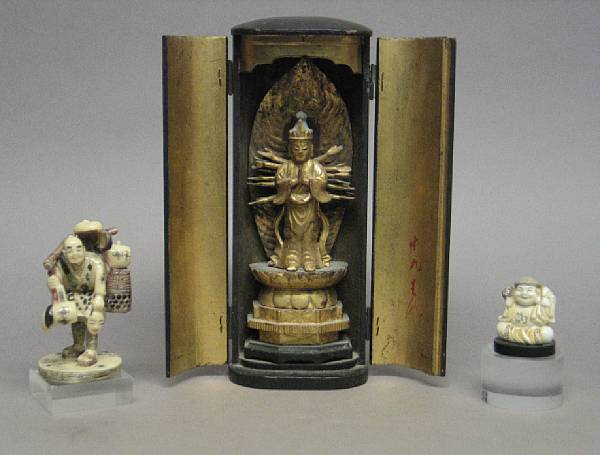 Appraisal: A gilt and black lacquered wood zoshi The traveling shrine