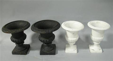 Appraisal: TWO PAIRS OF SMALL CAST IRON URNS One pair white