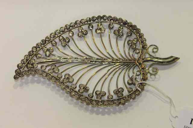 Appraisal: AN INDIAN WHITE METAL DISH of stylised shape form the