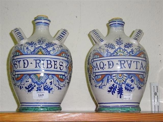 Appraisal: A PAIR OF ITALIAN POTTERY REPRODUCTION APOTHECARY JARS high