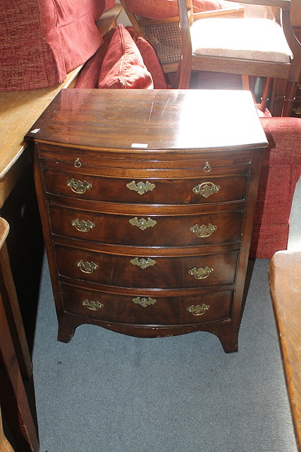 Appraisal: A MAHOGANY SMALL BOW FRONT CHEST of four graduated drawers