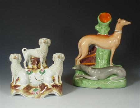 Appraisal: A mid Victorian Staffordshire spill vase of greyhounds one hound