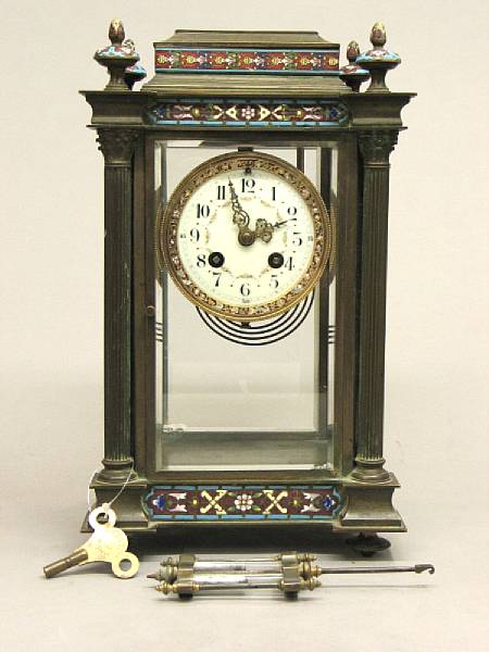 Appraisal: A French brass and champlev enamel four glass regulator mantel