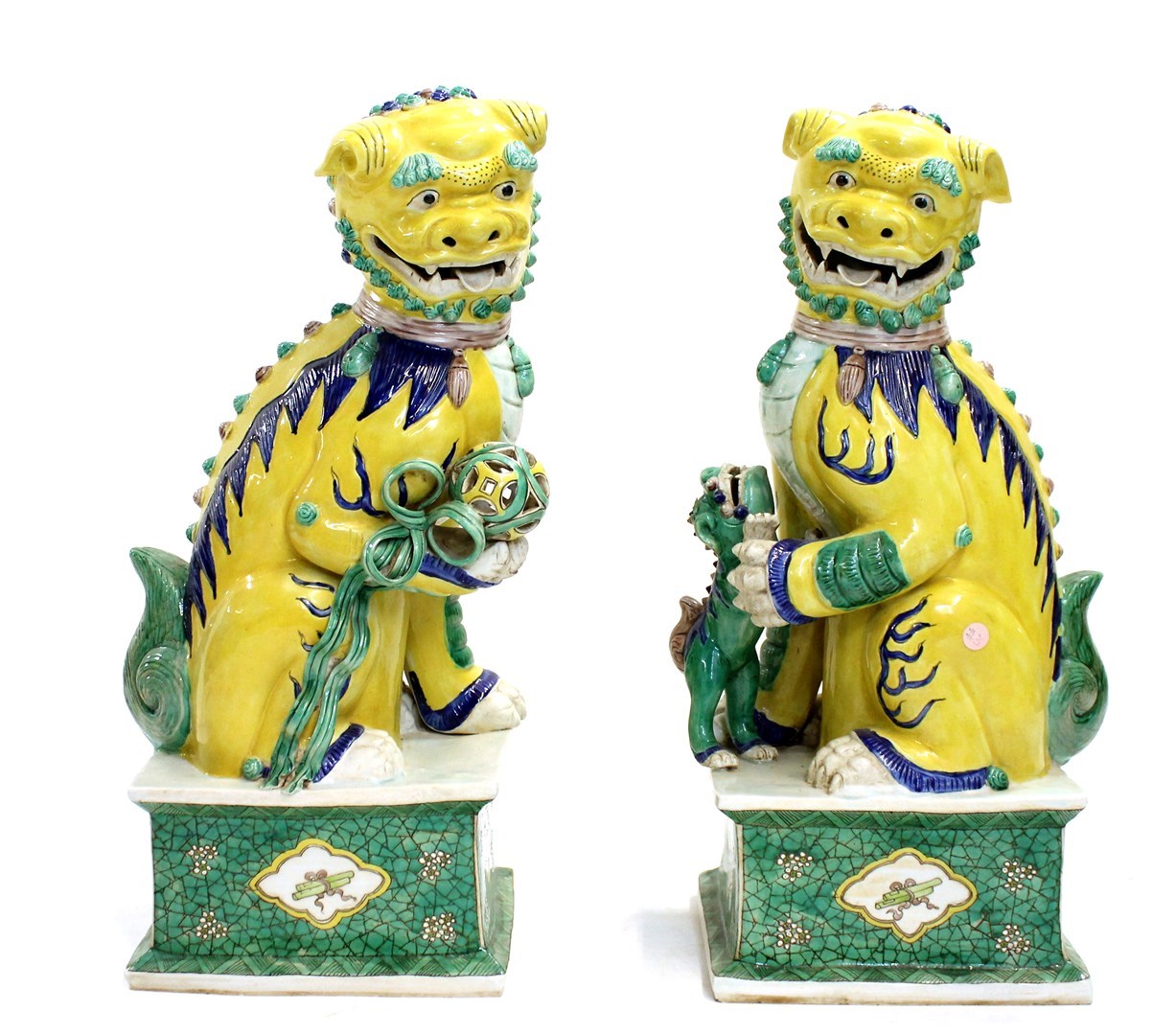 Appraisal: A pair of Chinese yellow Buddhist lions th century each