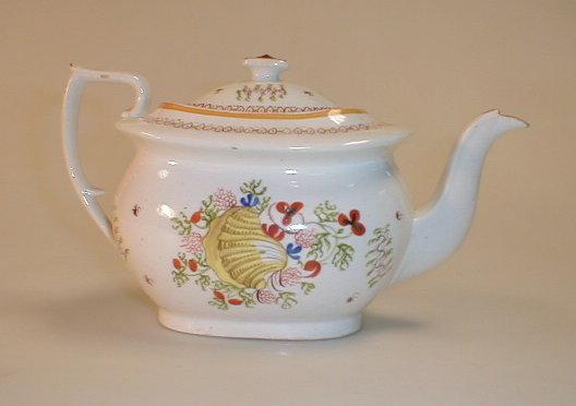 Appraisal: A Newhall silver-shape teapot painted with shells and seaweeds pattern