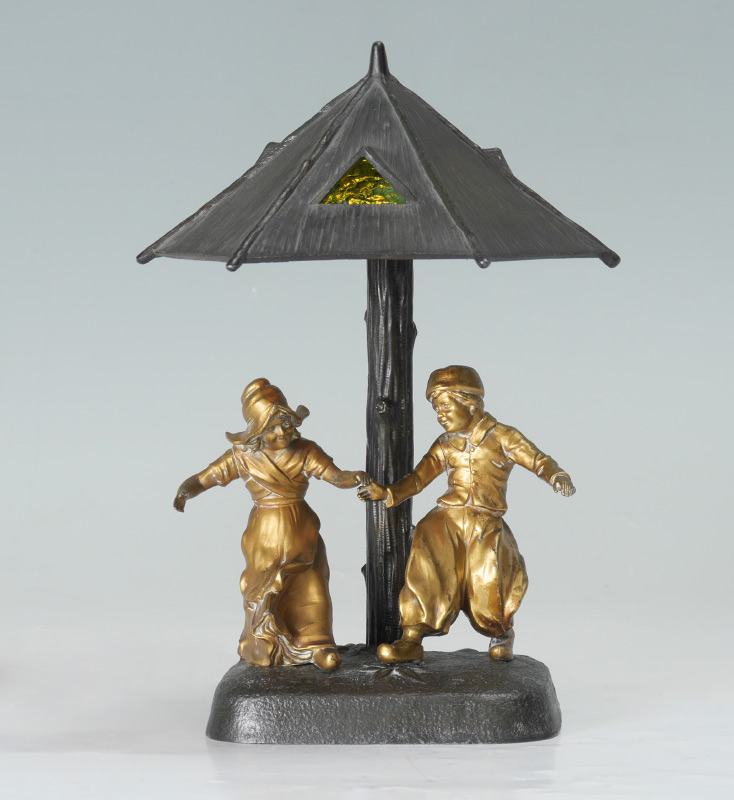 Appraisal: FIGURAL BRONZE GERMAN LAMP Bronze base with floral design tree