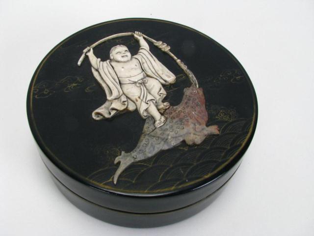 Appraisal: Lidded lacquered box in Asian design depicting ivory boy with