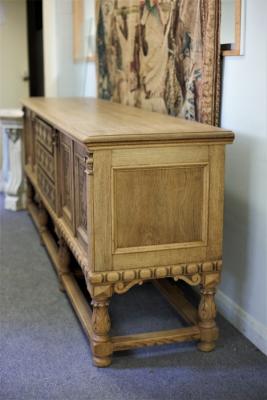 Appraisal: A bleached oak sideboard the three drawer front flanked by