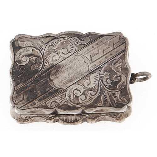 Appraisal: A Victorian silver vinaigrette engraved with scrolling foliage having conforming