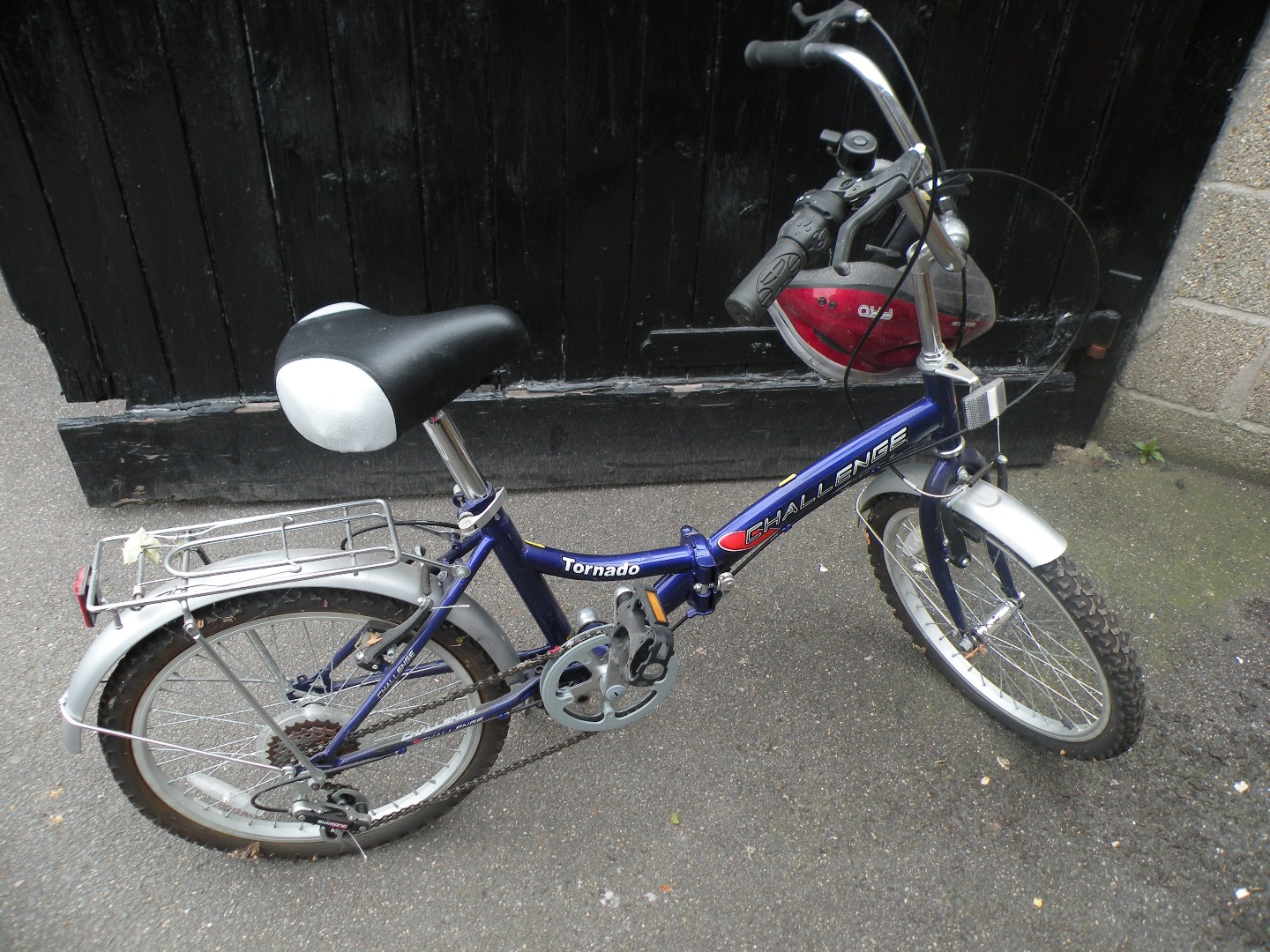 Appraisal: A Tornado Challenge ladies folding bike with helmet