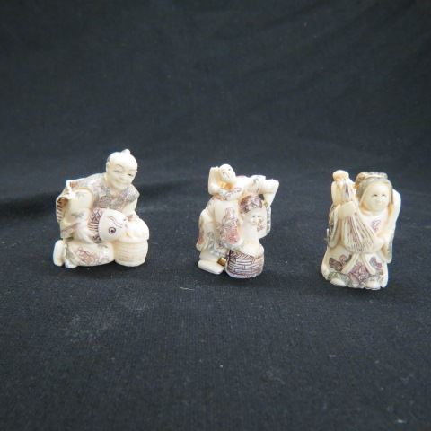 Appraisal: Carved Ivory Netsukes all fancy polychrome details approx signed excellent