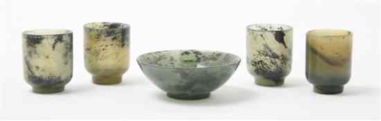 Appraisal: A Set of Four Jade Cups of green russet and