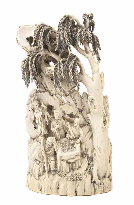 Appraisal: A Chinese Carved Ivory Figure of a Mountain depicting figures