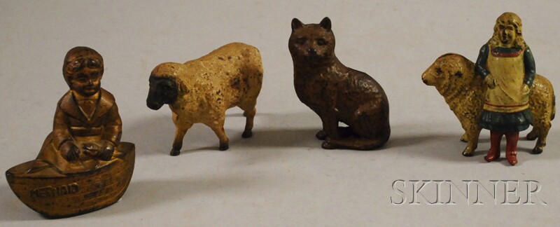 Appraisal: Four Polychrome-painted Cast Iron Figural Banks a sheep a cat