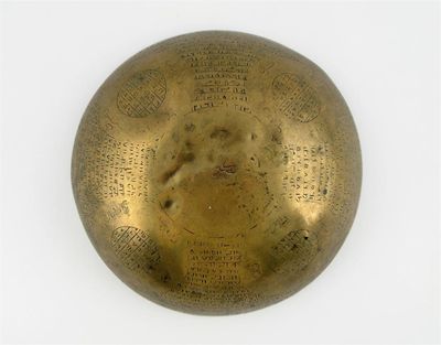 Appraisal: A Middle Eastern brass divination bowl engraved to the interior