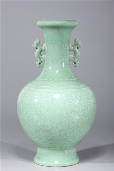 Appraisal: Chinese celadon glazed porcelain vase with molded handles and incised