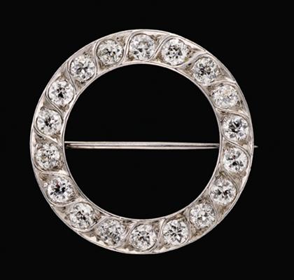 Appraisal: Platinum and diamond circle pin Eighteen Old European cut diamonds