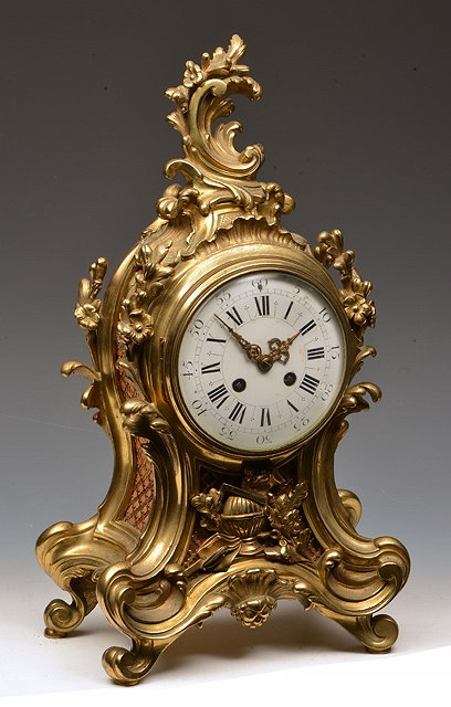 Appraisal: A LOUIS XV STYLE GILT METAL MANTEL CLOCK the convex