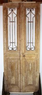 Appraisal: Antique pine doors with inset iron panels Antique pine doors