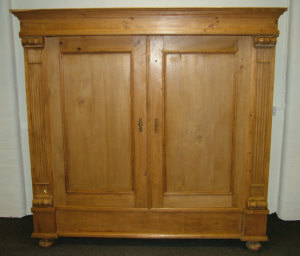 Appraisal: A Swedish pine double wardrobe th century the cornice over