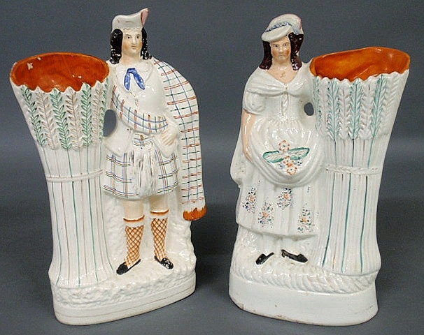 Appraisal: Two similar Staffordshire figural and sheaf of wheat spill vases